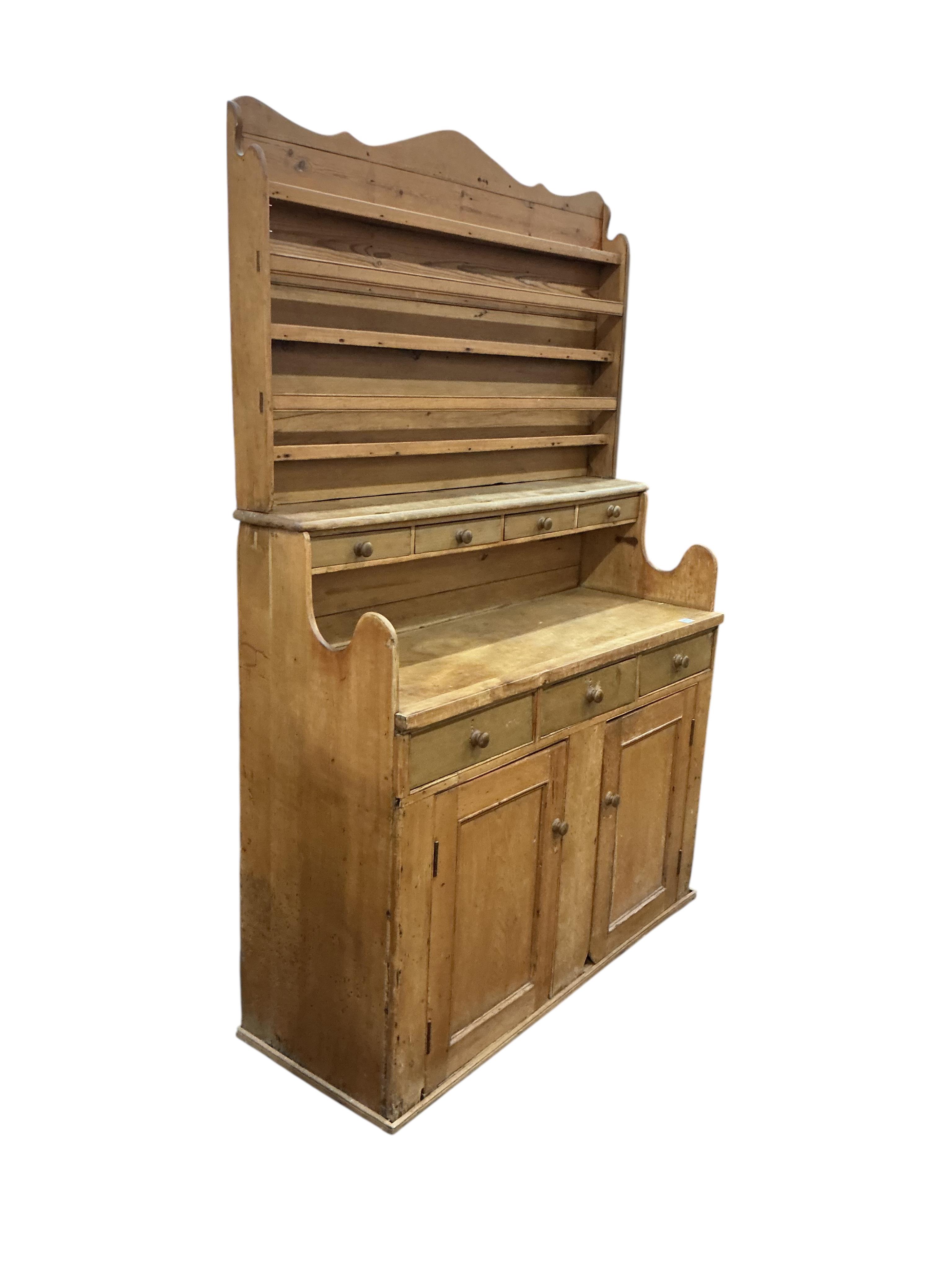 A 19th century Continental pine dresser, width 137cm, depth 50cm, height 210cm